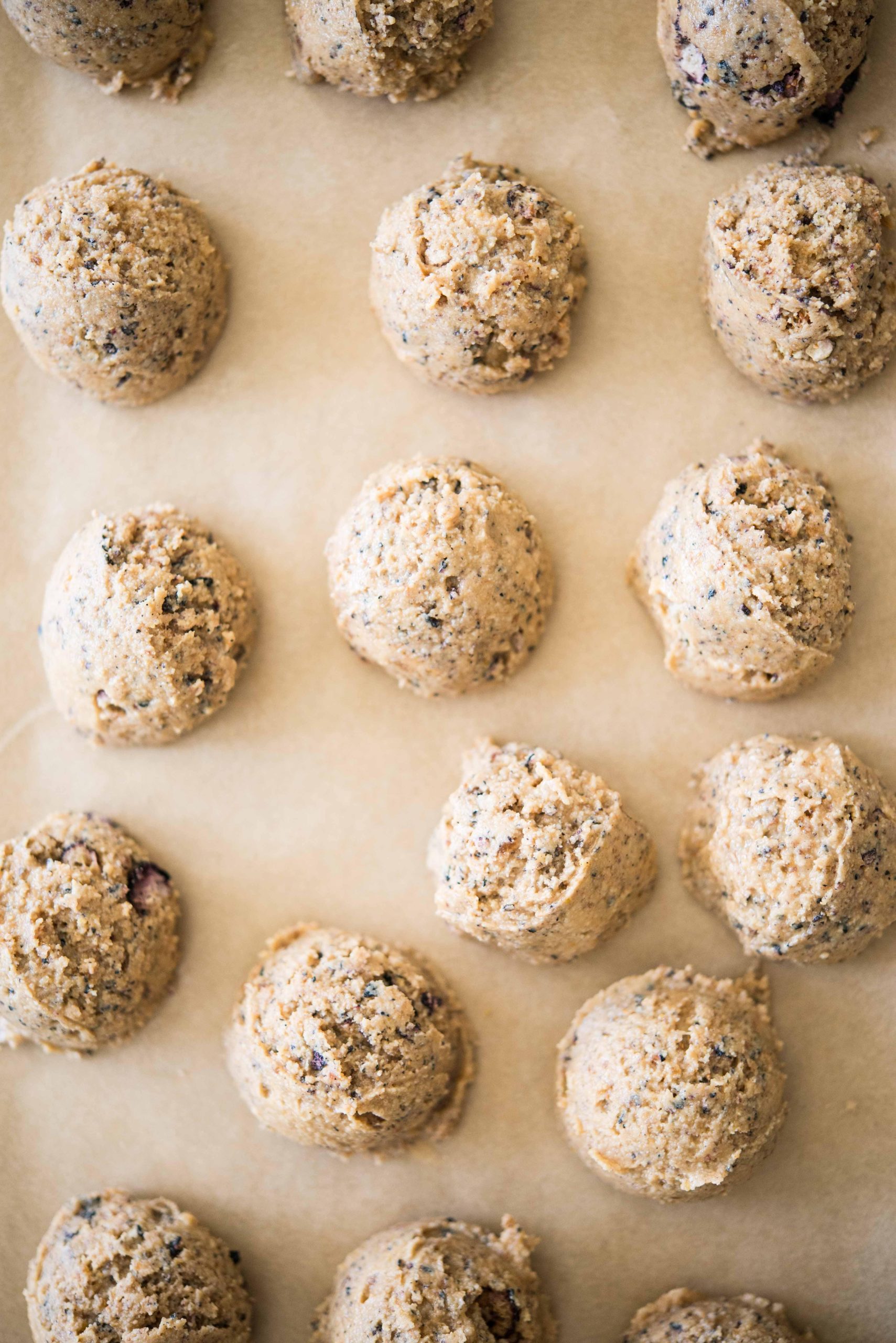 no-bake blueberry energy balls on parchment paper